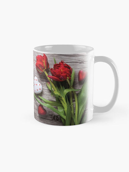 Mug for loved ones (with red roses on a wooden background)